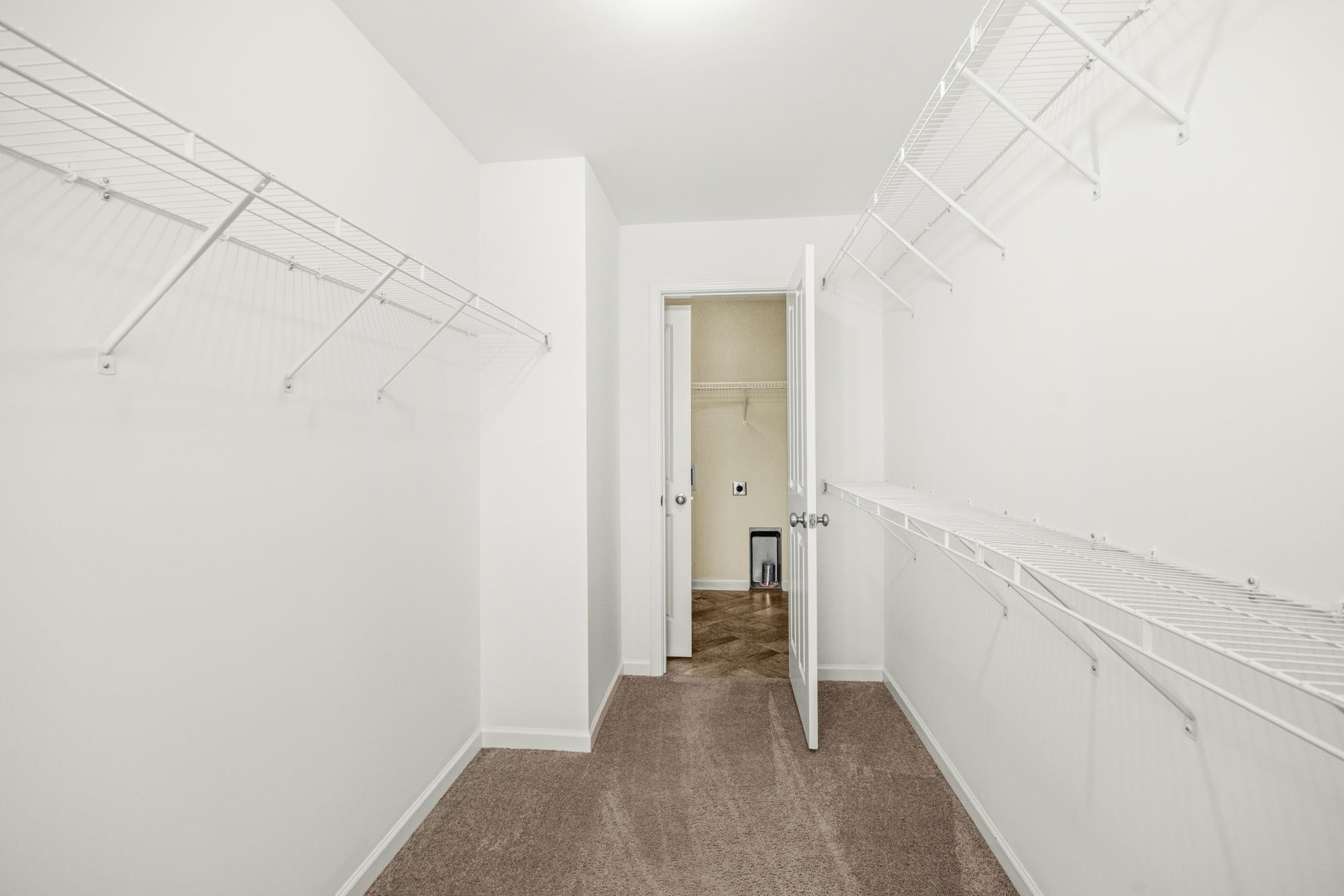 112 Bergen Drive Spring Hill, TN 37174 - Photo 28 of 37 a view of a hallway with wooden floor and a bathroom