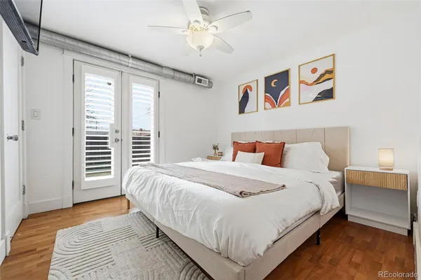 a bedroom with bed and a window