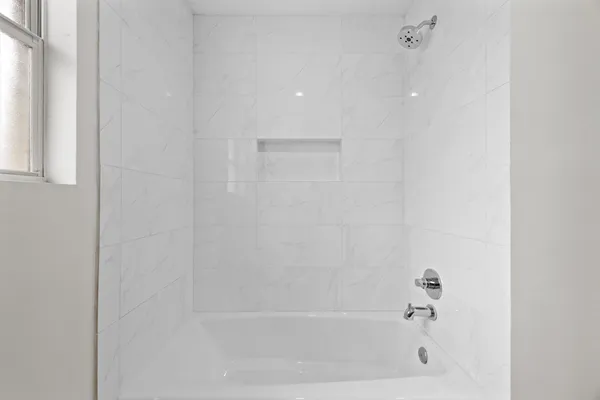 a close up of a bathtub curtain