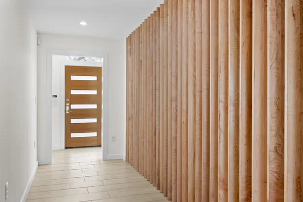 a view of a room with a wooden door