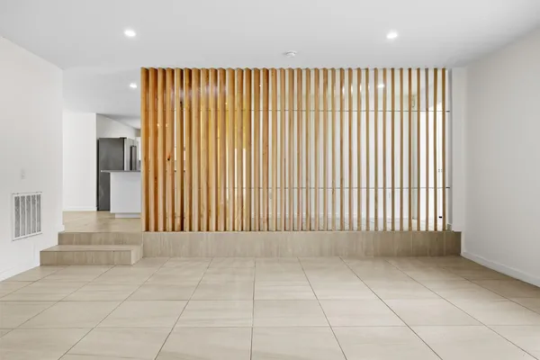 a view of an empty room with a window