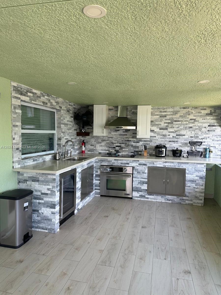 2212 Club House Road North Fort Myers, FL 33917 - Photo 26 of 40 a kitchen with stainless steel appliances a stove and a microwave
