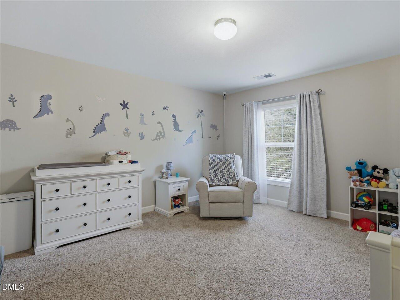 1200 Kinleywood Court Raleigh, NC 27603 - Photo 24 of 30 a bedroom with furniture and a bed