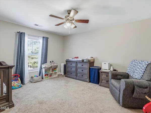 a room with a desk and a couch