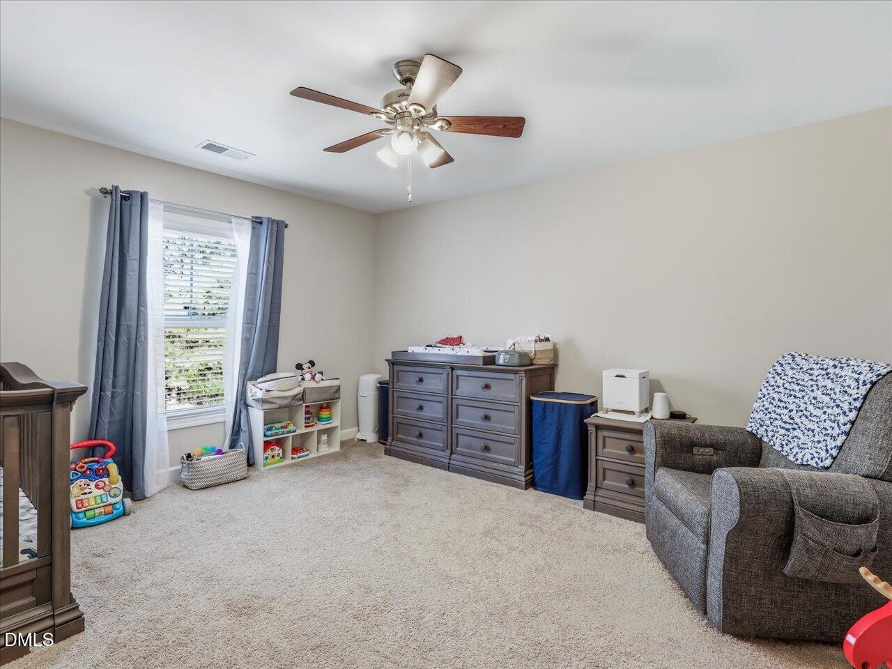 1200 Kinleywood Court Raleigh, NC 27603 - Photo 26 of 30 a view of a livingroom with furniture and a ceiling fan