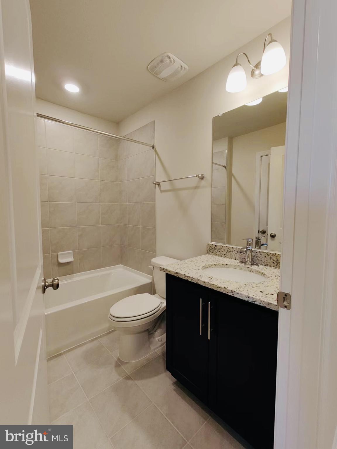 552 Union Street Frederick, MD 21701 - Photo 22 of 58 a bathroom with a sink a toilet and shower