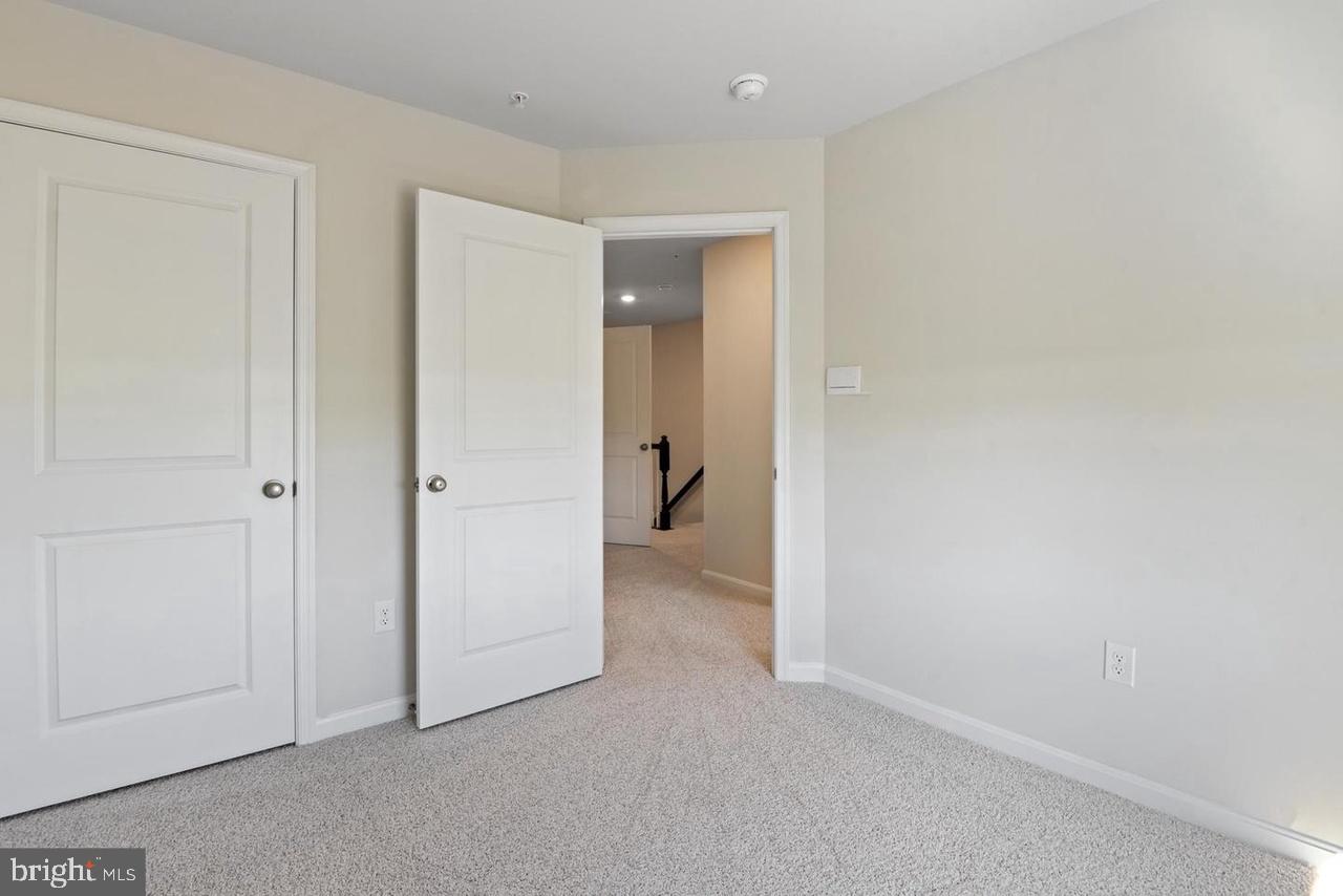 552 Union Street Frederick, MD 21701 - Photo 25 of 58 an empty room with closet and a bathroom