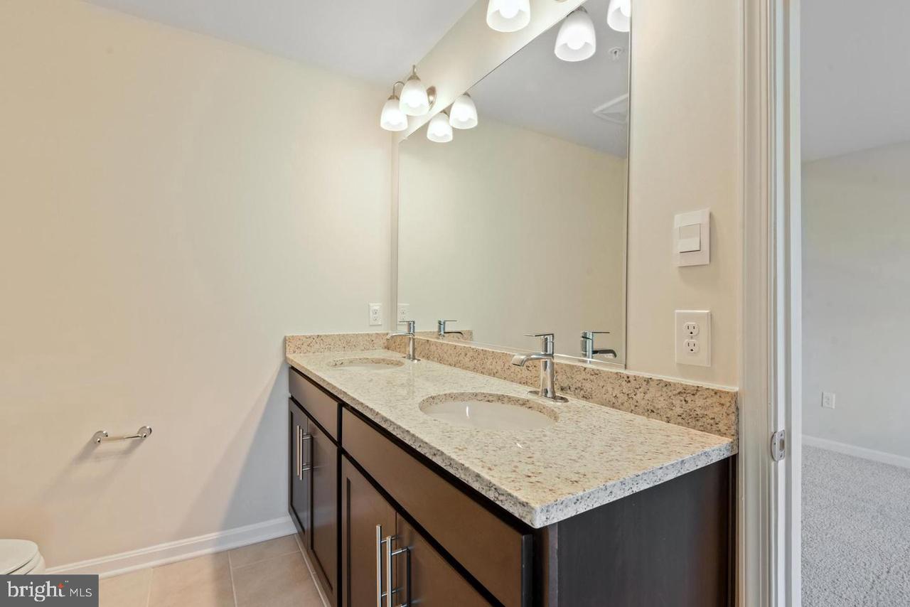 552 Union Street Frederick, MD 21701 - Photo 30 of 58 a bathroom with a sink and a mirror