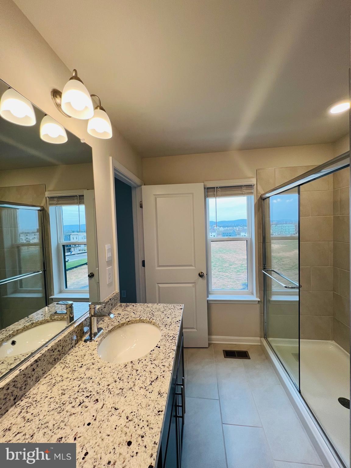 552 Union Street Frederick, MD 21701 - Photo 32 of 58 a bathroom with a tub sink and mirror