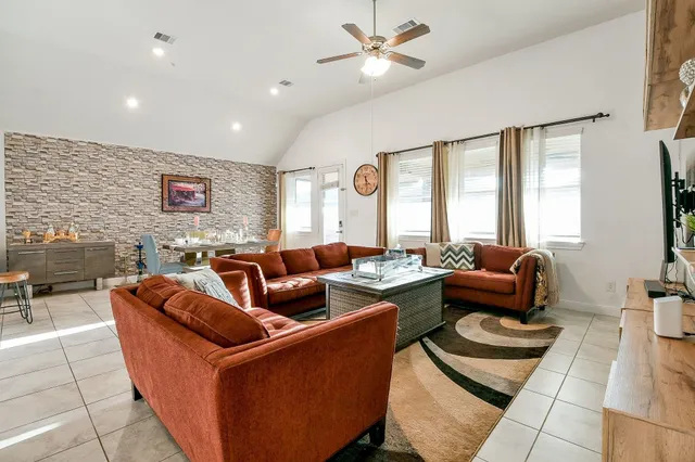 a en suite bathroom with a tub sink and mirror