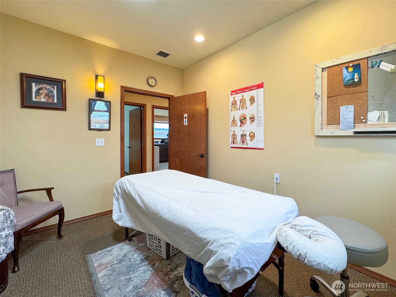 534 North 5th Avenue, Unit 7 Sequim, WA 98382 - Photo 11 of 38 a bedroom with a bed and a table in it