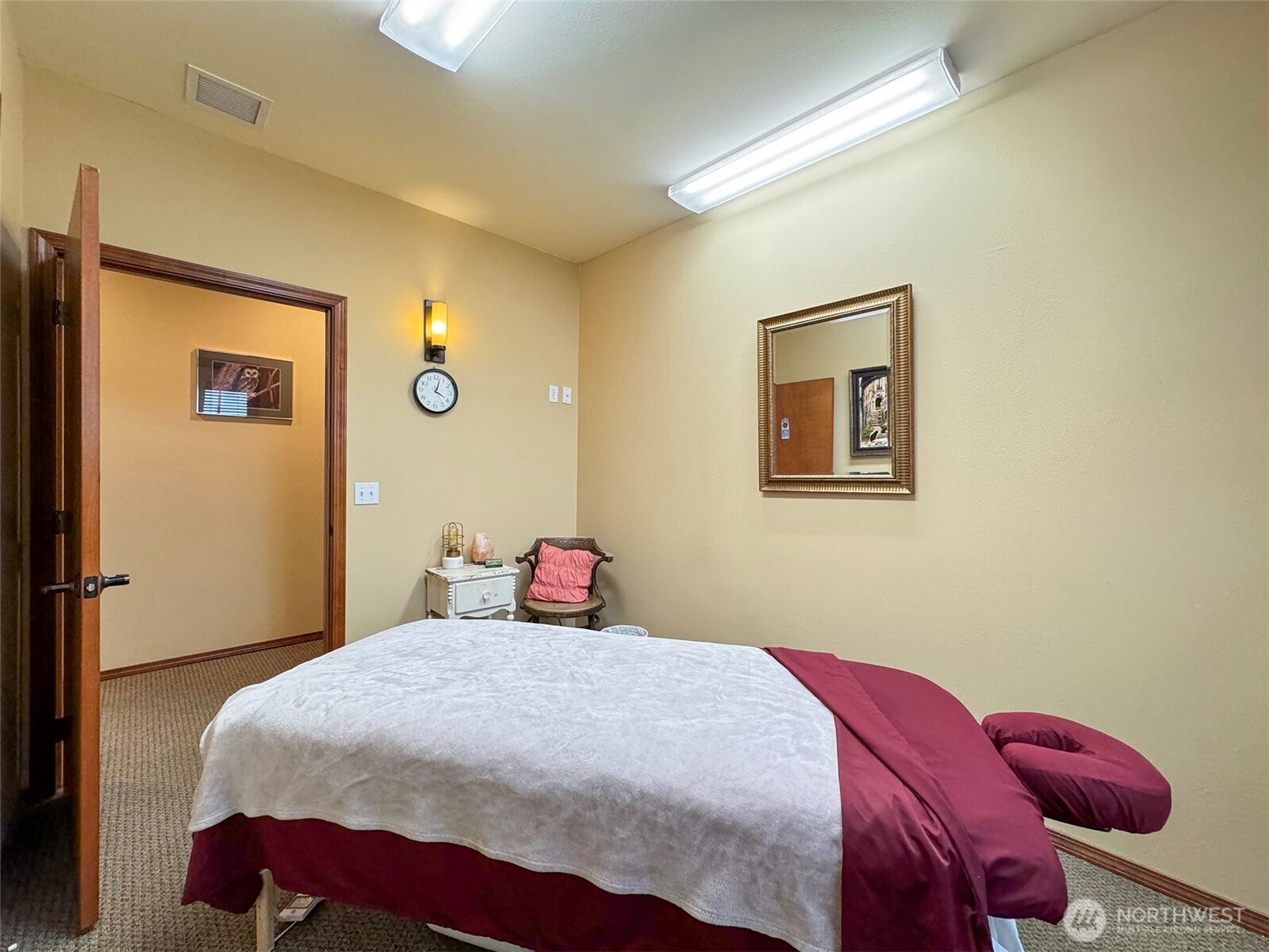 534 North 5th Avenue, Unit 7 Sequim, WA 98382 - Photo 20 of 38 a bedroom with a bed and wooden floor