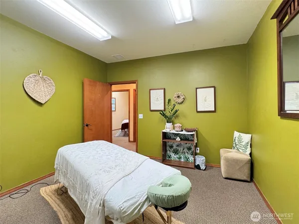 a bedroom with a bed and a table