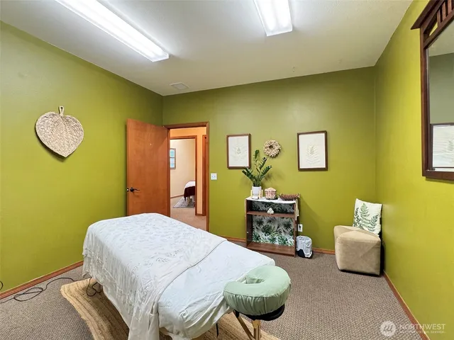 a bedroom with a bed and a table