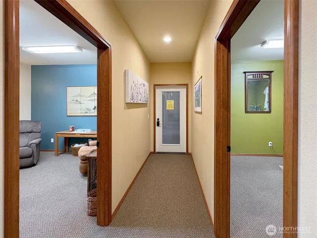 a view of a hallway view with three rooms