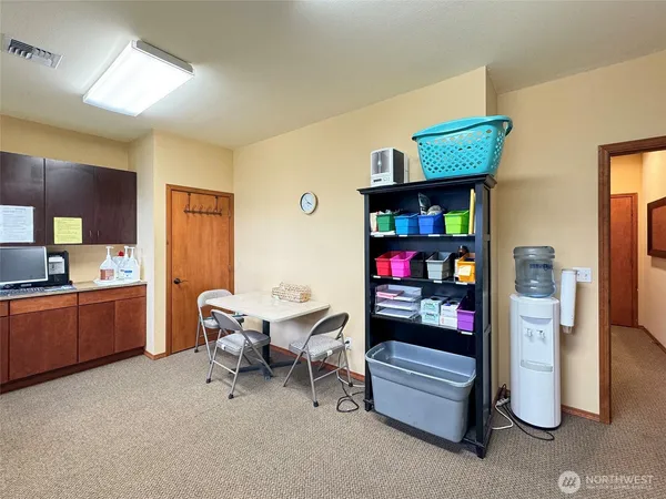 a room with furniture and a kitchen