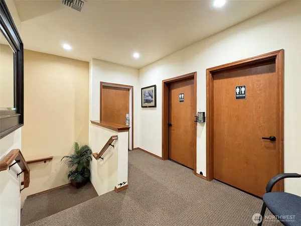 a room with gym equipment and a walk in closet