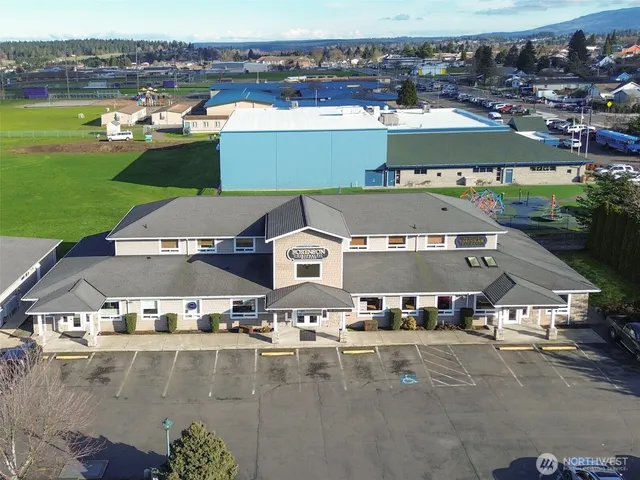 an aerial view of a house with outdoor space
