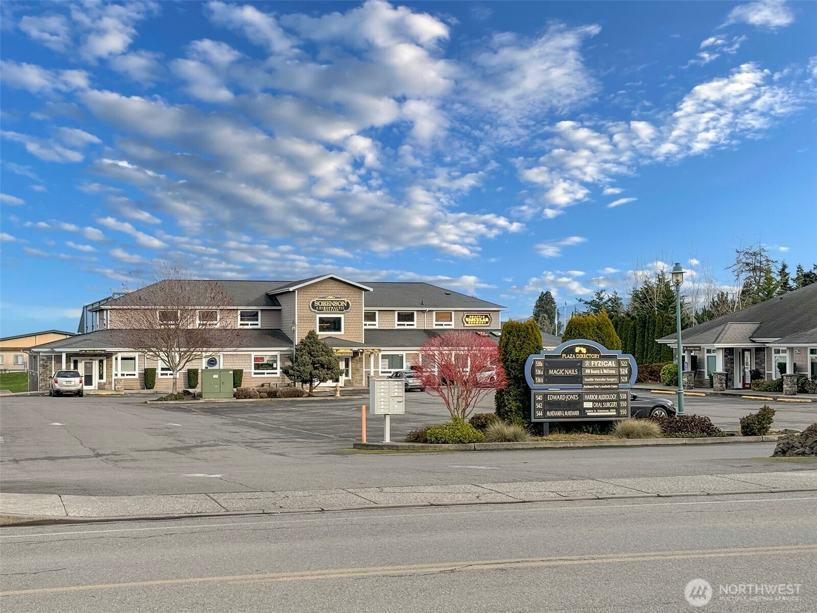 534 North 5th Avenue, Unit 7 Sequim, WA 98382 - Photo 37 of 38 a front view of a building with lot of cars and trees