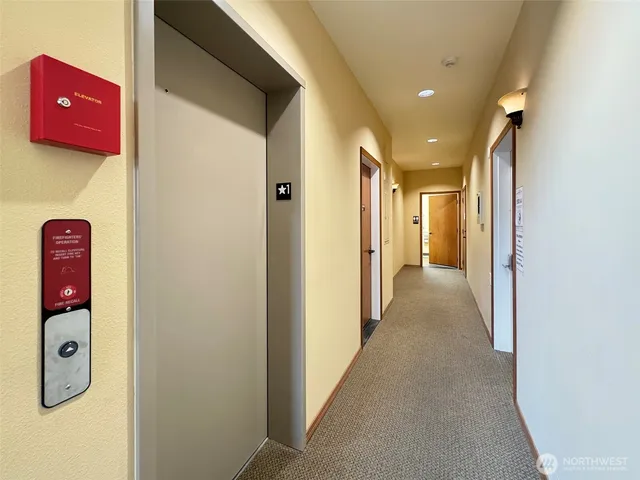 a view of a hallway with elevator