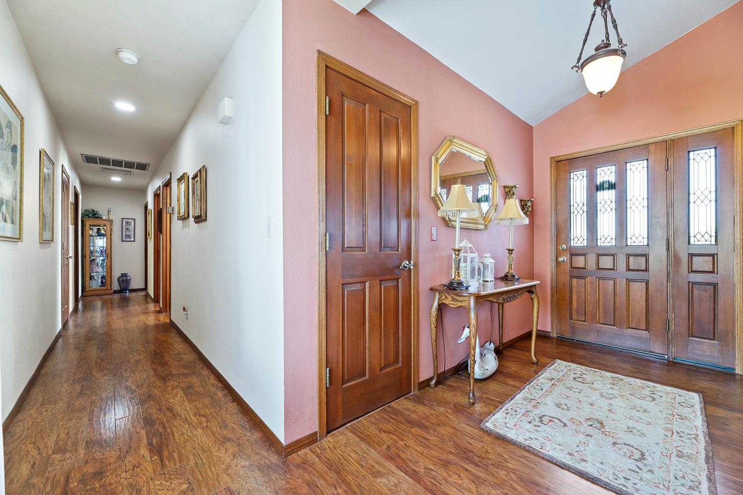 36360 Highway 33 Coalinga, CA 93210 - Photo 12 of 50 a view of a hallway with wooden floor and windows
