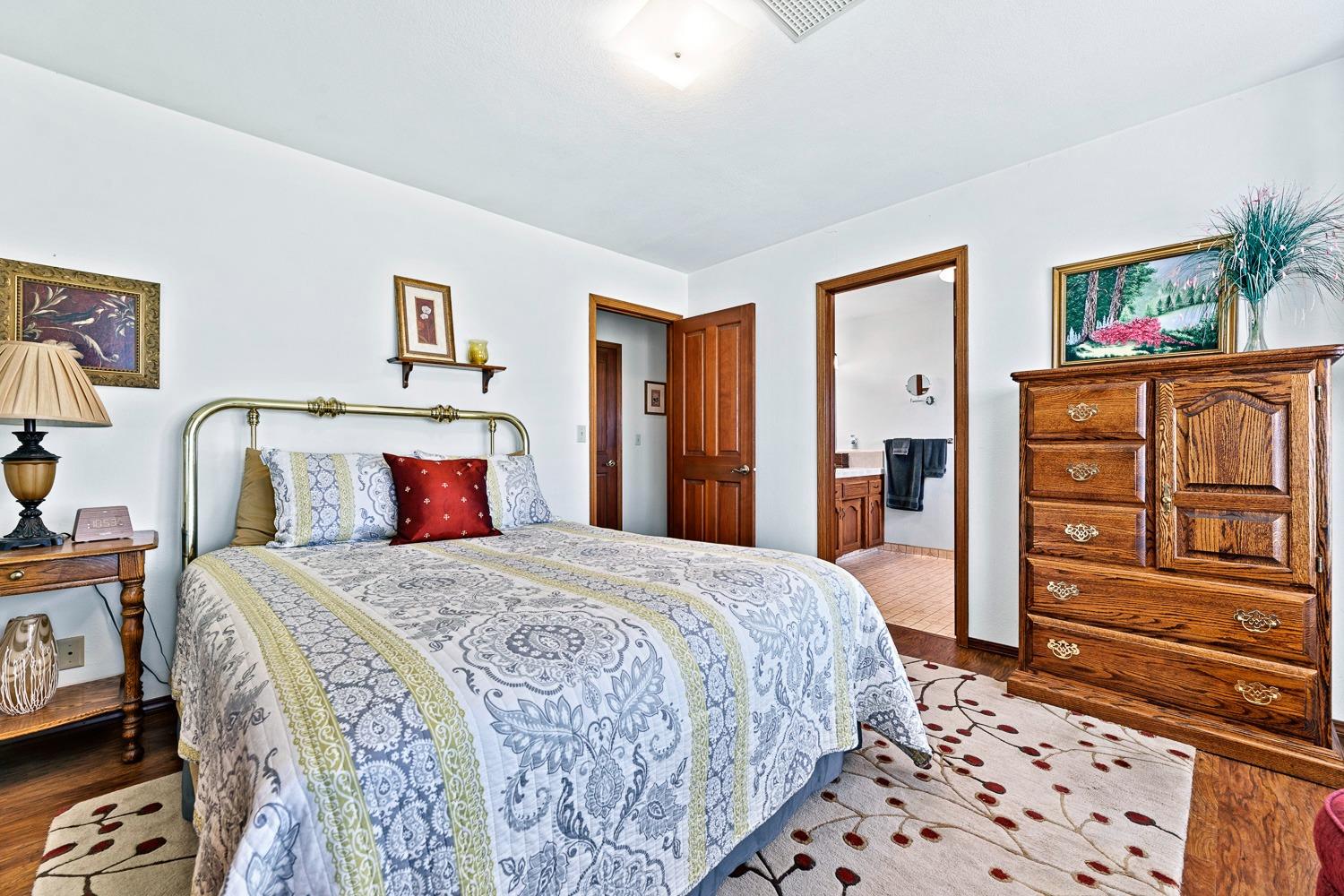 36360 Highway 33 Coalinga, CA 93210 - Photo 14 of 50 a bedroom with a bed and a dresser