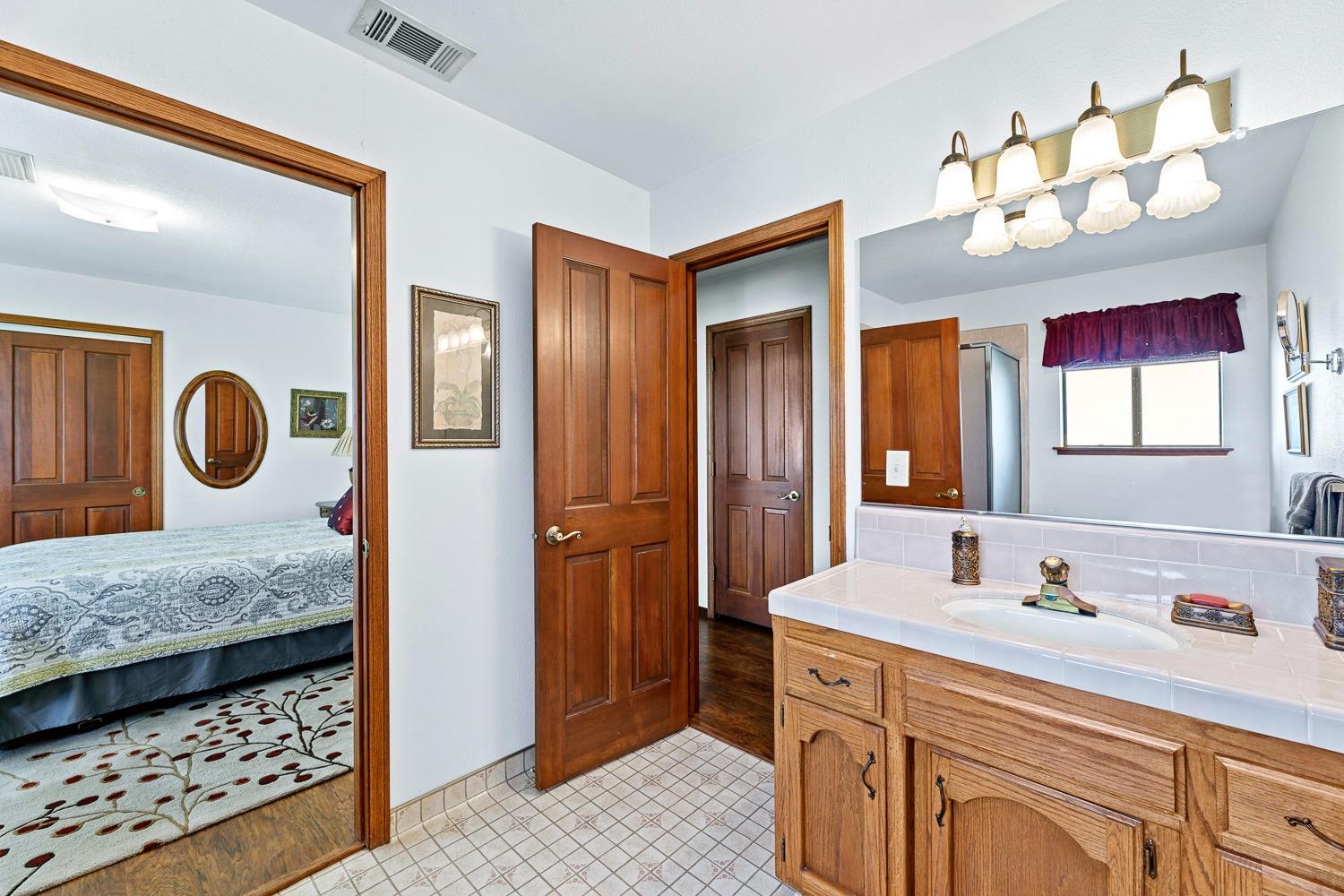 36360 Highway 33 Coalinga, CA 93210 - Photo 15 of 50 a bathroom with a sink a vanity and a mirror
