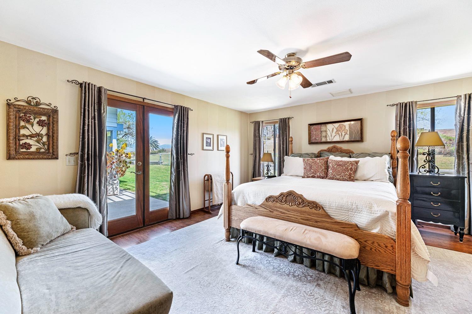 36360 Highway 33 Coalinga, CA 93210 - Photo 21 of 50 a bedroom with a large bed couch and a window