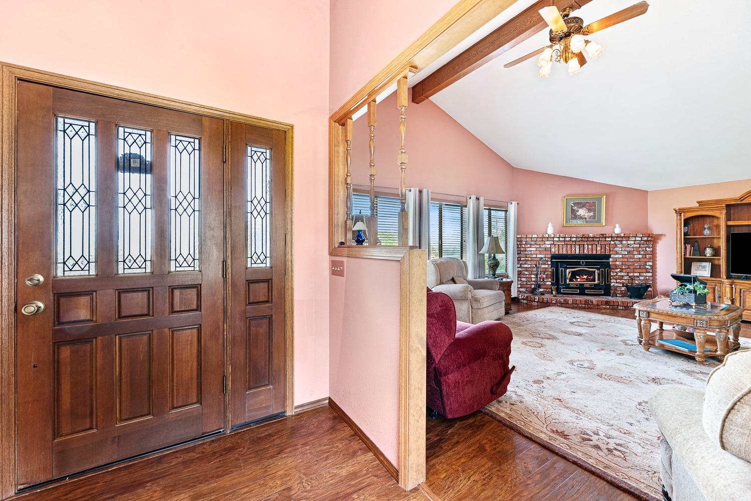 36360 Highway 33 Coalinga, CA 93210 - Photo 24 of 50 a living room with furniture a fireplace and a flat screen tv