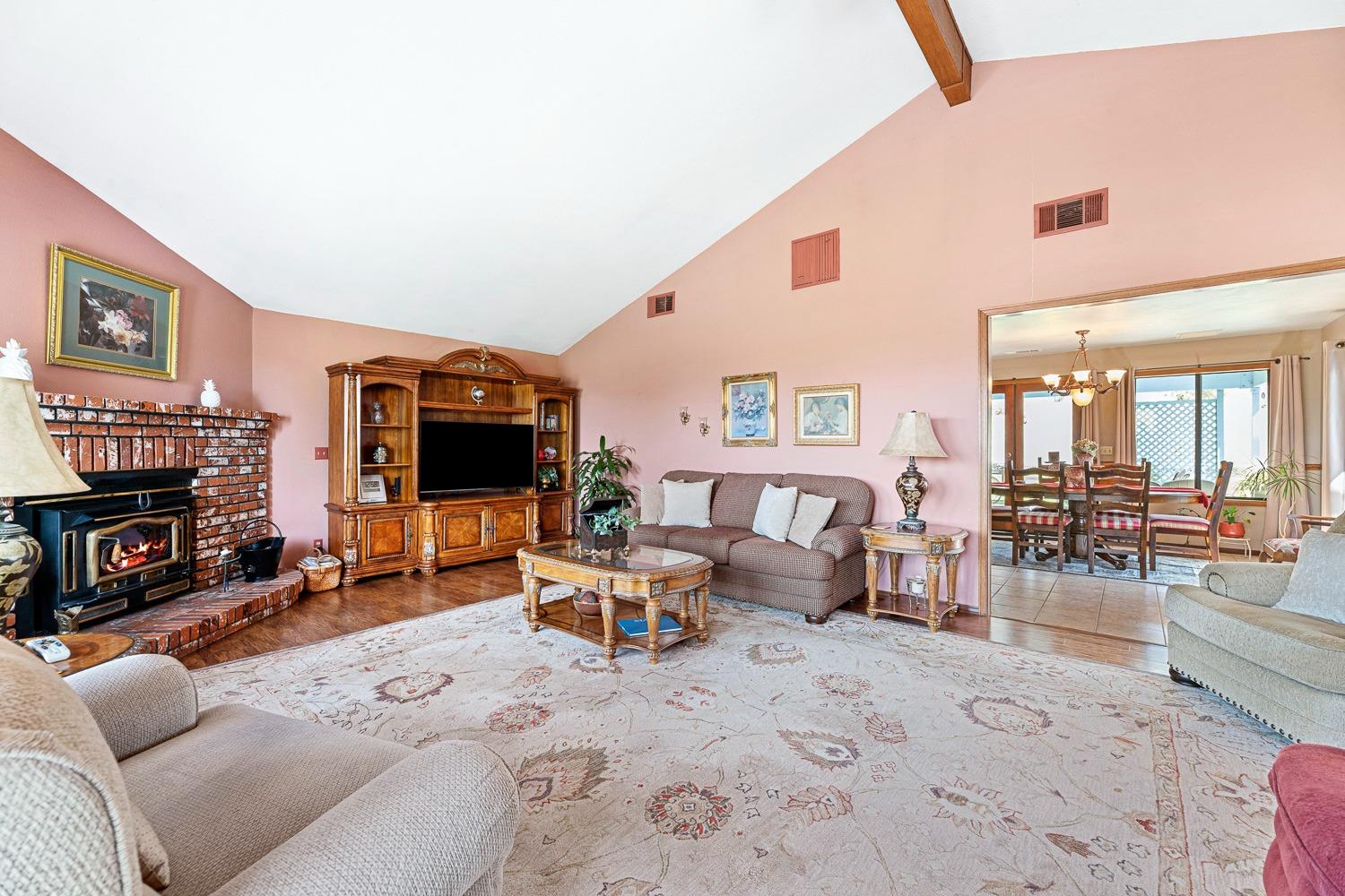 36360 Highway 33 Coalinga, CA 93210 - Photo 27 of 50 a living room with furniture a fireplace and a flat screen tv
