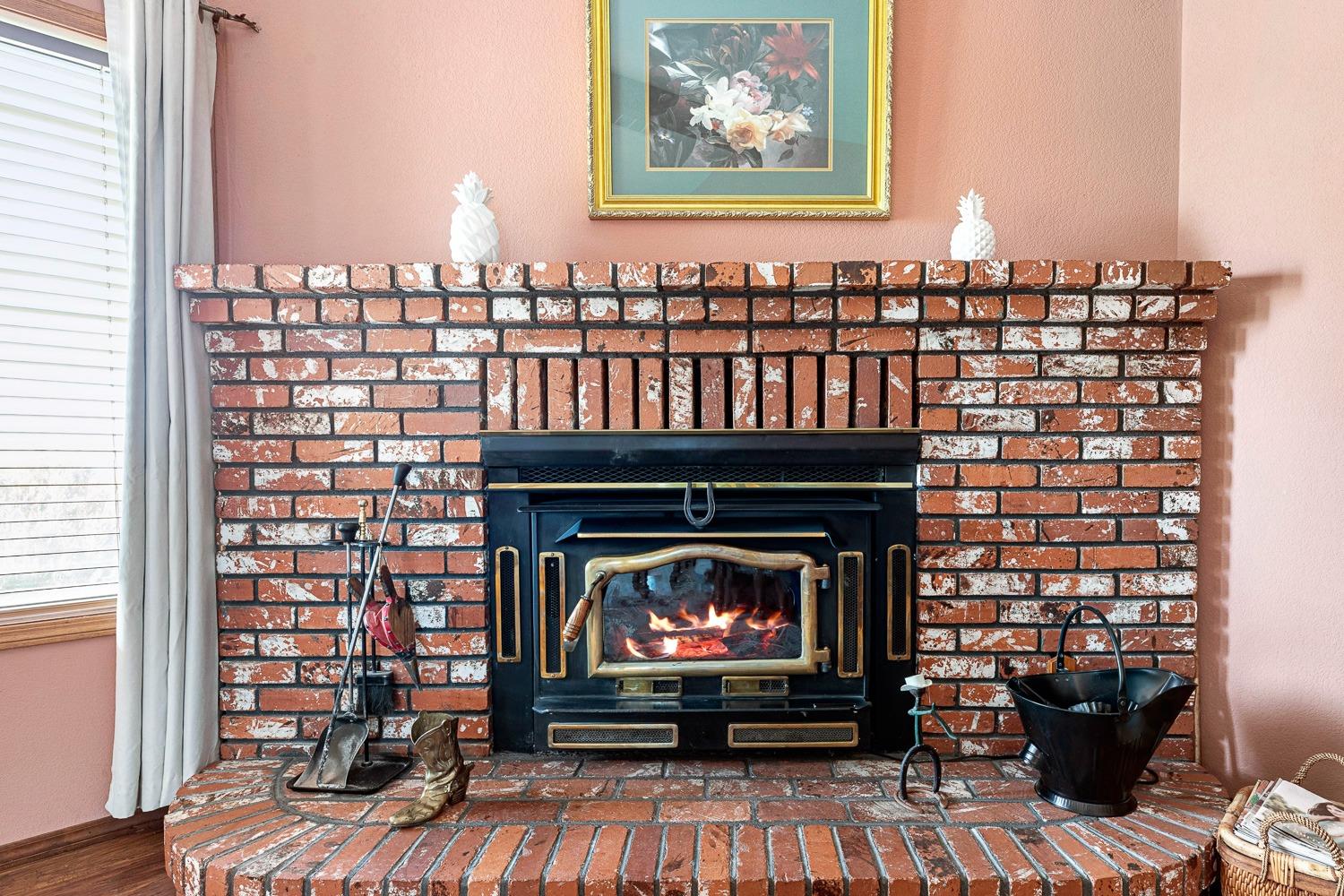 36360 Highway 33 Coalinga, CA 93210 - Photo 28 of 50 a view of a fireplace with furniture and a fireplace