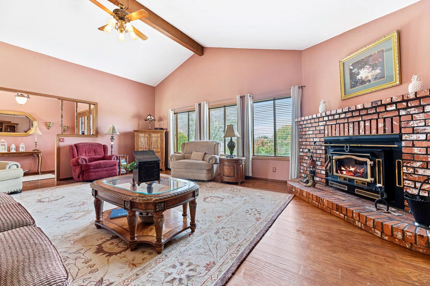 36360 Highway 33 Coalinga, CA 93210 - Photo 29 of 50 a living room with furniture and a fireplace