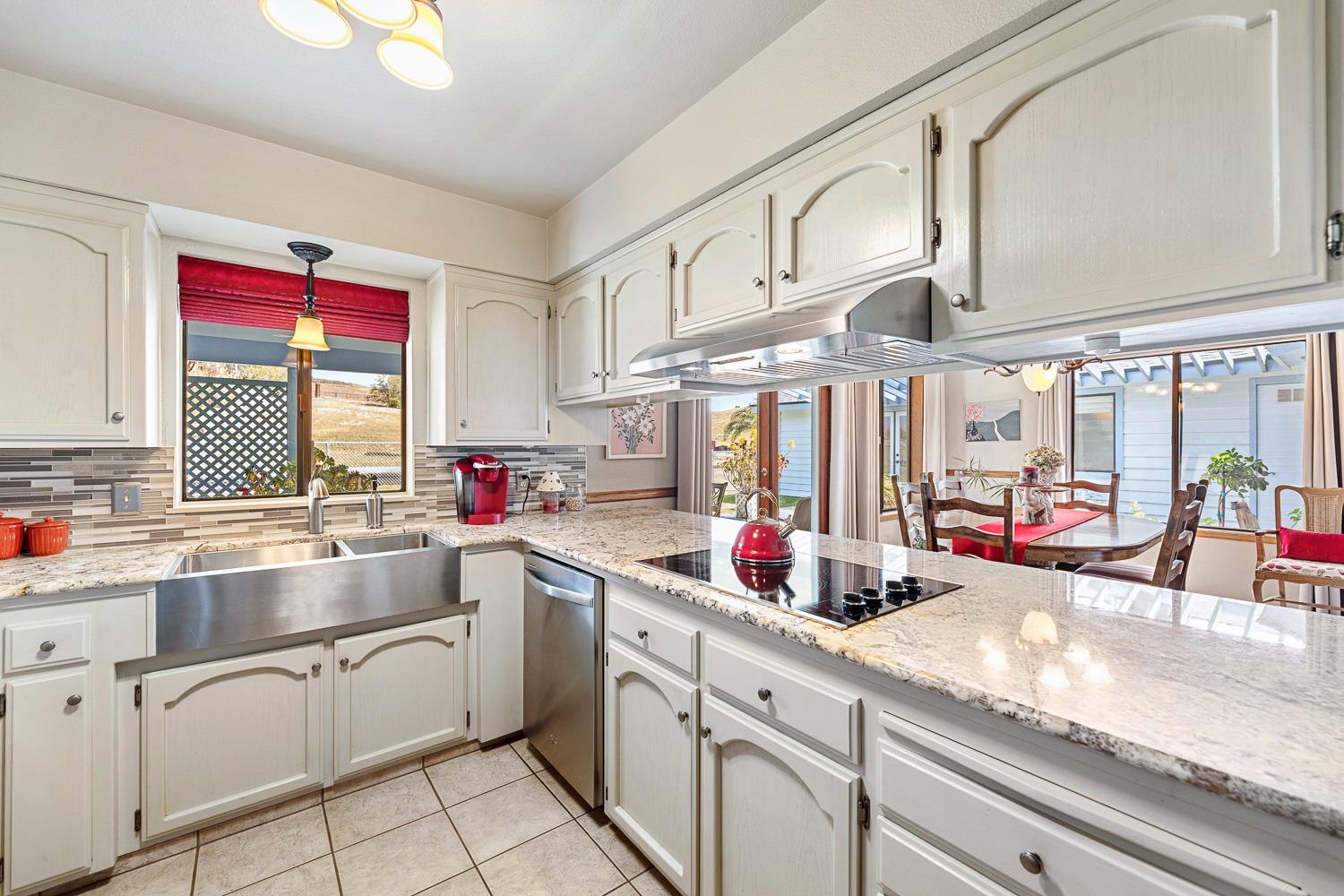 36360 Highway 33 Coalinga, CA 93210 - Photo 34 of 50 a kitchen with sink cabinets and window