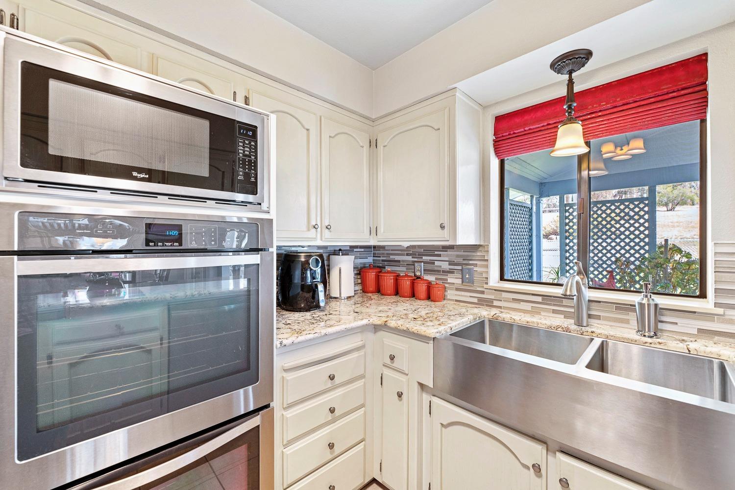 36360 Highway 33 Coalinga, CA 93210 - Photo 35 of 50 a kitchen with stainless steel appliances a stove microwave and sink