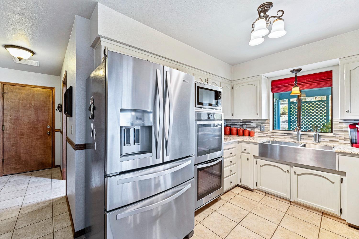 36360 Highway 33 Coalinga, CA 93210 - Photo 36 of 50 a kitchen with stainless steel appliances a refrigerator sink and cabinets