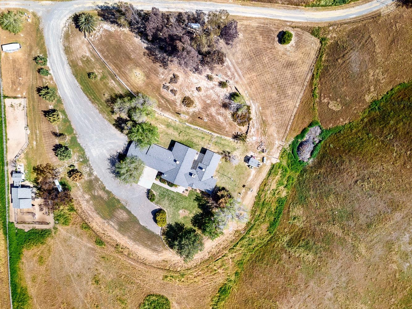 36360 Highway 33 Coalinga, CA 93210 - Photo 43 of 50 an aerial view of a house with a yard and mountain