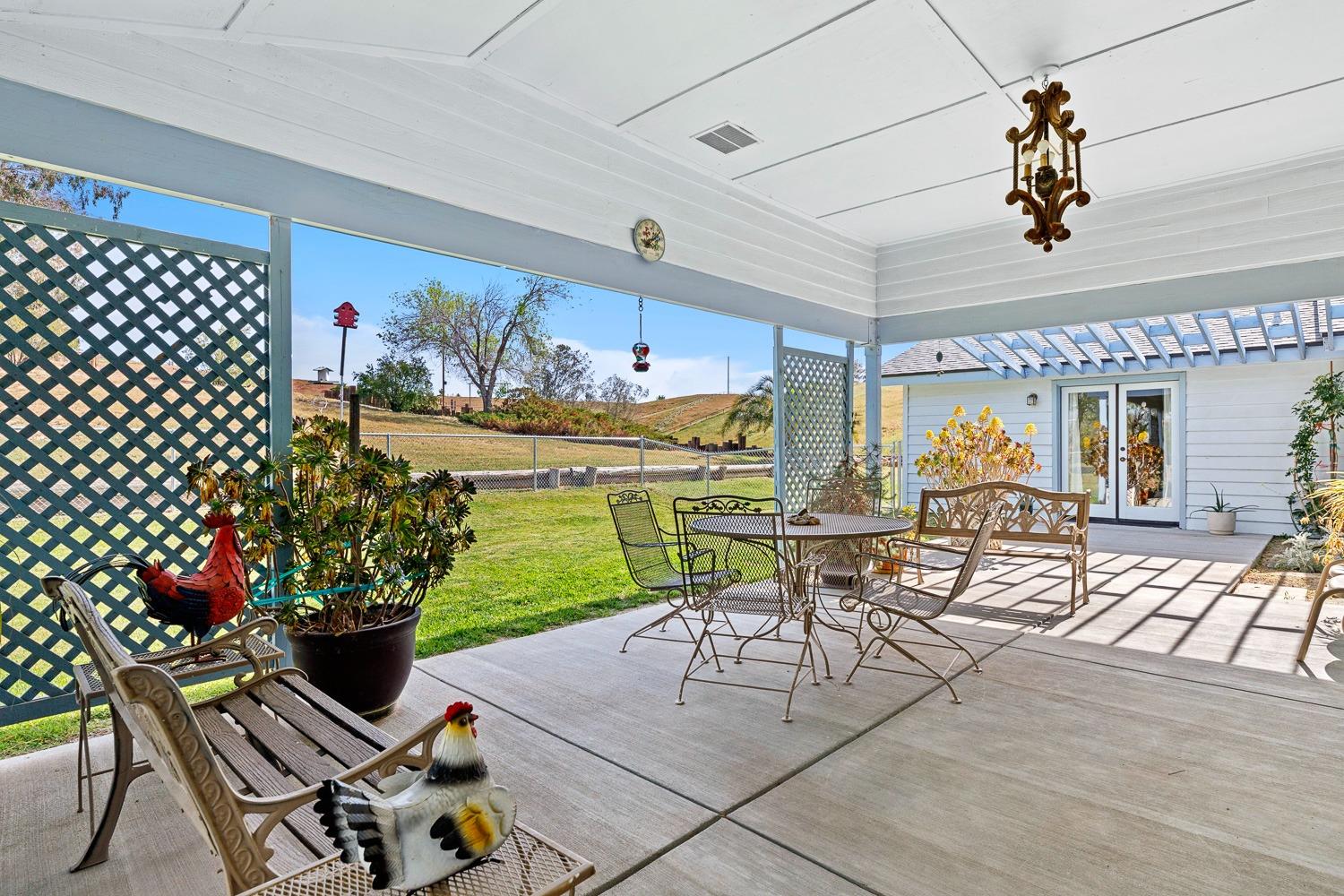 36360 Highway 33 Coalinga, CA 93210 - Photo 8 of 50 a view of a dining room with furniture a chandelier and wooden floor