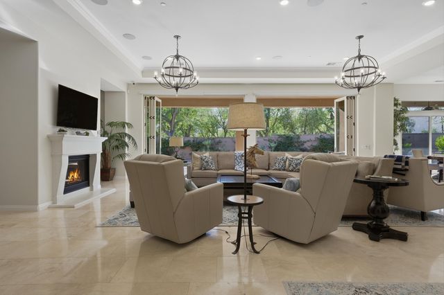 a view of a livingroom with furniture and window