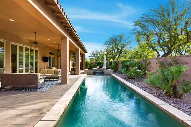 a view of swimming pool with seating area