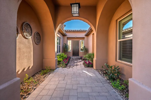 a view of kitchen with granite countertop dining table chairs and wooden floor