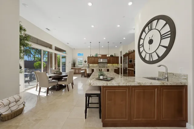 a bedroom with a bed furniture and a large window