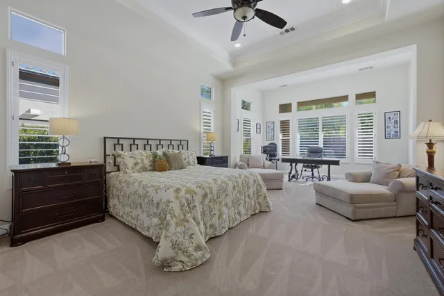 an aerial view of a house with a swimming pool