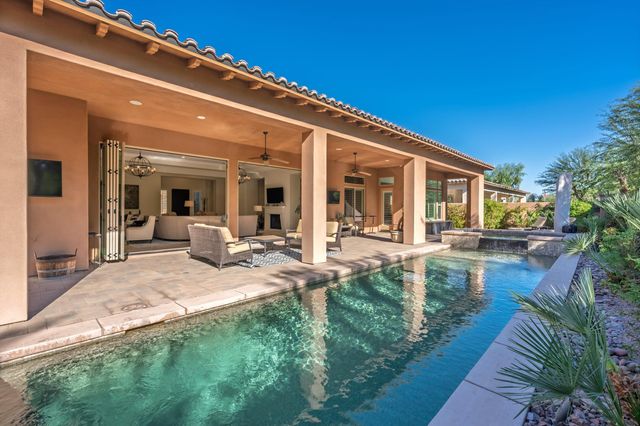 a view of a patio with table and chairs and potted plants