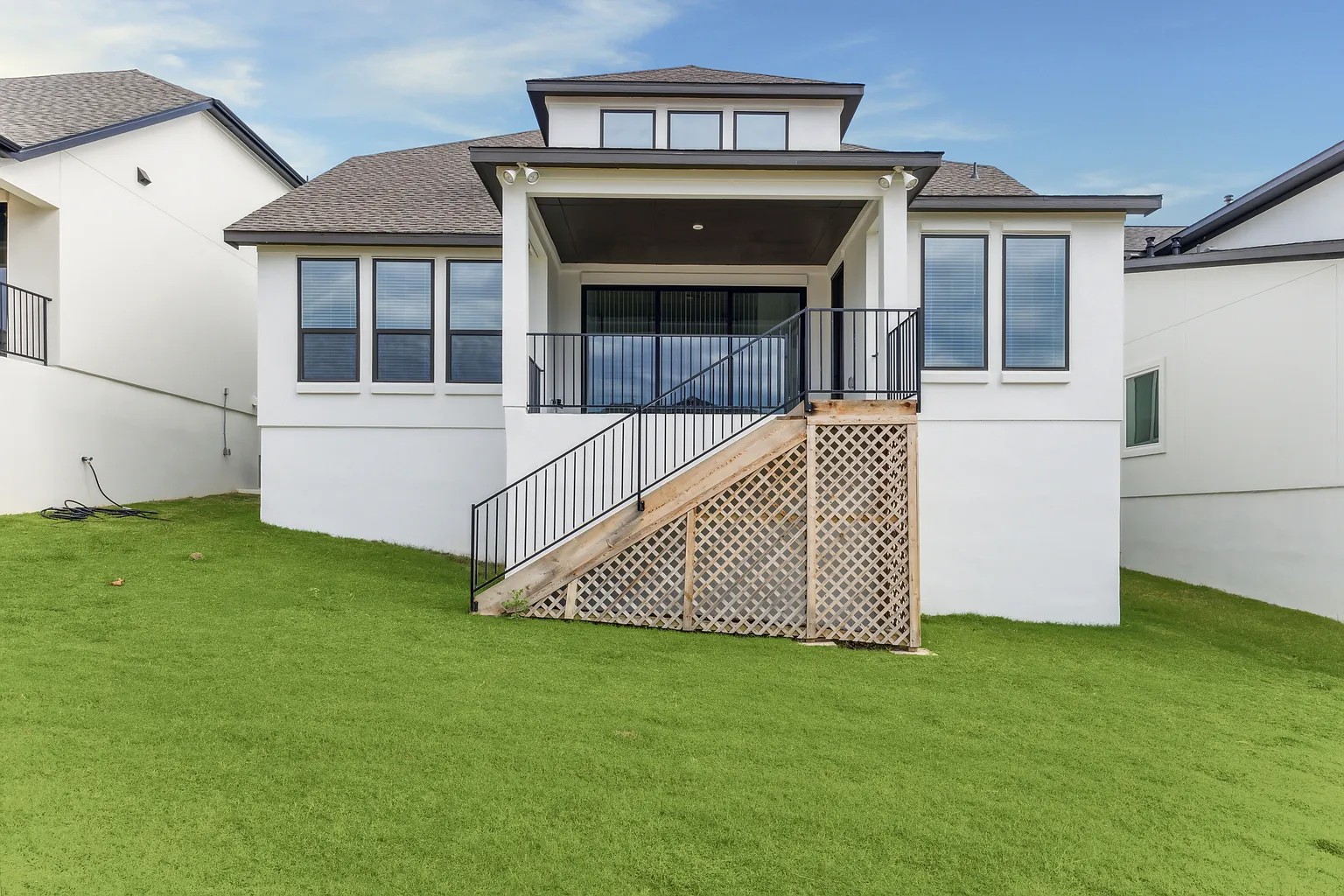 1909 Varese Path Leander, TX 78641 - Photo 39 of 40 A tiered backyard with a covered patio and accessible stairway beckons for outdoor enjoyment.
