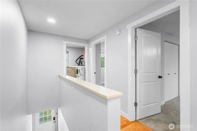 a view of a hallway to a bedroom