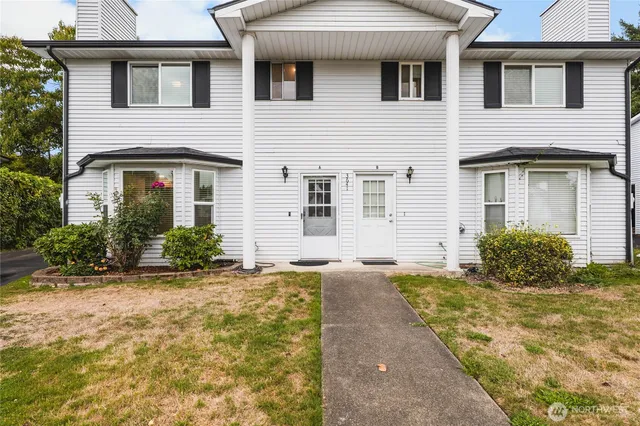 a front view of a house with a yard