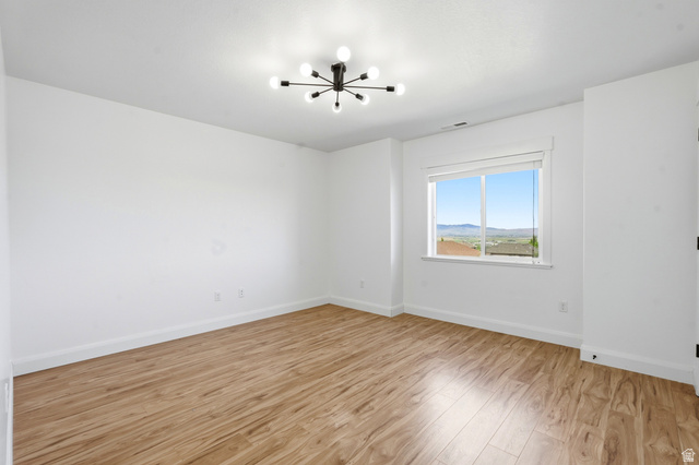 338 Windy Rdg Drive Smithfield, UT 84335 - Photo 25 of 63 Open room featuring wood-finish flooring and white baseboards