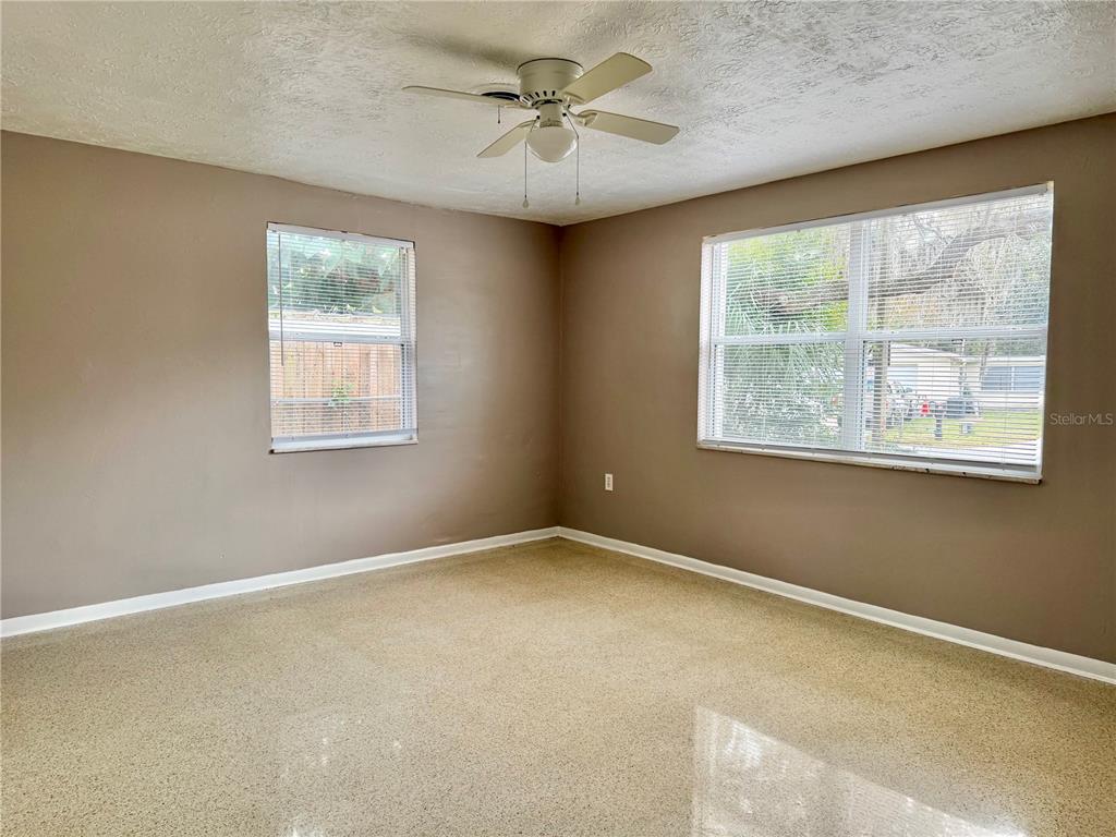 7441 Banner Street New Port Richey, FL 34653 - Photo 12 of 20 an empty room with a window and a fan