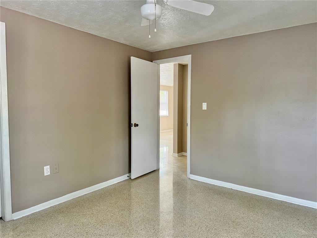 7441 Banner Street New Port Richey, FL 34653 - Photo 15 of 20 an empty room and chandelier fan