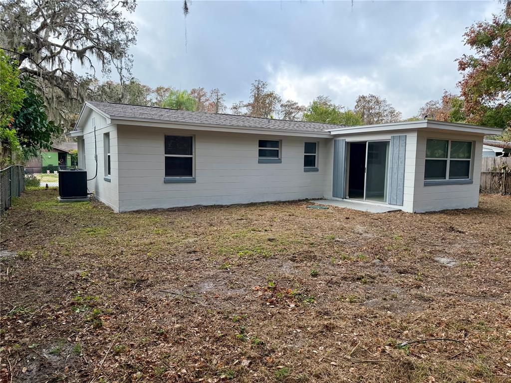 7441 Banner Street New Port Richey, FL 34653 - Photo 19 of 20 a view of a house with a yard
